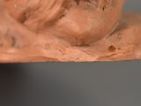 a close up of a clay sculpture of a man ' s face