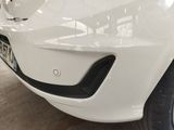 a close up of a white car with a number plate on it