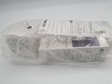 three packages of soap sitting on top of each other on a table