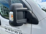 an image of a side view mirror of a van