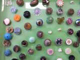 a green tray with buttons and buttons on it