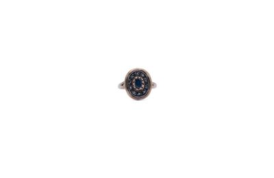 a close up of a ring on a white surface with a white background