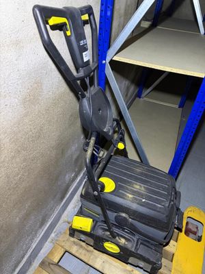 a yellow and black suitcase sitting on a pallet in a warehouse
