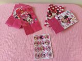 pink minnie mouse party bags and stickers on a pink blanket