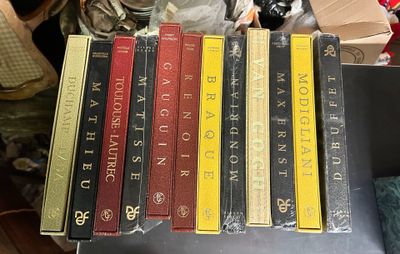 a lot of books that are sitting on a table
