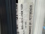a ticket that is taped to the side of a window