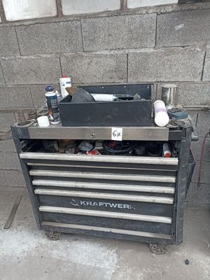 a black tool box with a lot of tools on it