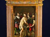 an image of a painting of a man holding a sword in front of a group of people
