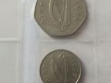 two coins sitting on top of each other on a table