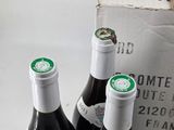 three bottles of wine that are sitting in a box
