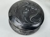 a black box with a design on it on a table