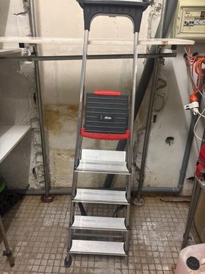 an image of a ladder in a room with a lot of tools