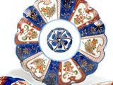 three plates with different designs on them on a white surface