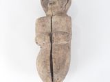an old wooden sculpture of a man with a hat on his head