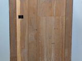 a wooden cabinet with a door on the side of it