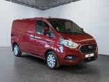 the red van is parked in a large room with white walls