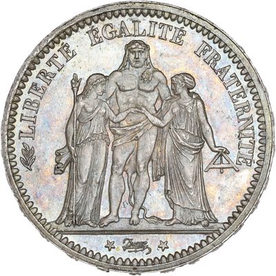 a close up of a coin with a man and a woman on it