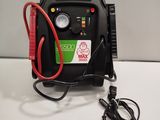 a black and red air compressor sitting on a table