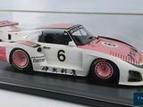 a model of a racing car on display in a glass case