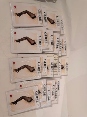 several packages of hair clips are on a white surface