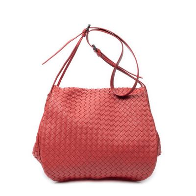 a red woven bag on a white background