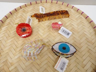 a lot of hair accessories that are on the table