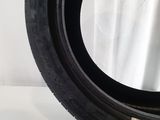 a close up of a tire on a white surface