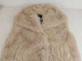 an image of a fur vest on a white table