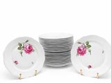 a set of six white plates with pink roses on them