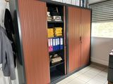 a cabinet that has a bunch of folders on it