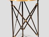 une image représentant une table ronde avec un piètement en métal et un plateau noir