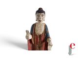 a small statue of a buddha with a red robe