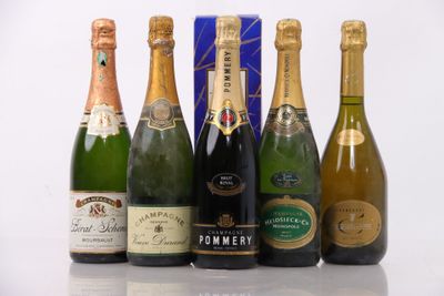 six bottles of champagne are lined up in a row on a table