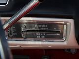 a dashboard of a car with a radio and a steering wheel
