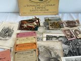 an old collection of books and pamphlets sitting on a bed