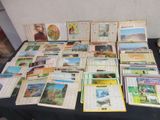 a table with a bunch of books and pictures on it