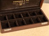 a brown box with a bunch of compartments inside of it