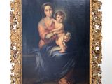 an old painting of a woman holding a child in her lap