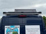 a van that has a sign on the back of it