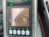 a close up of a motorcycle dashboard with a digital display
