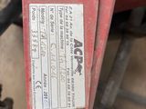 a label on the side of a red machine