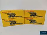 three boxes of dinky toys are sitting on a table