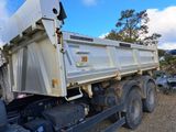 a dump truck that is parked in a lot