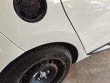 a close up of a car ' s tire with the door open