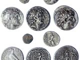 an image of a group of ancient coins on a white surface