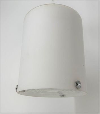 a white lamp hanging from the ceiling in a room