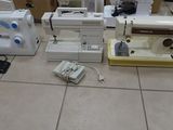 many different types of sewing machines sitting on the floor