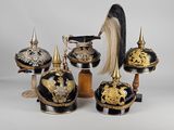 a lot of helmets that are sitting on top of each other