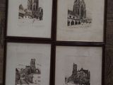 four framed drawings of a church and a church with a clock on the wall