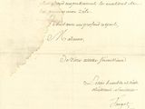 une vieille lettre écrite à l'encre noire sur un morceau de papier